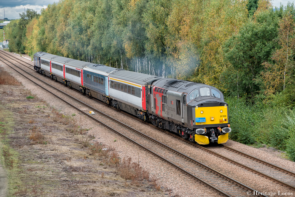 37510 "Orion" leads the 1Z27 Derby to Barrow Hill Beer Festival charter round the old road through Beighton Junction. 57312 brings up the reareighton Junction